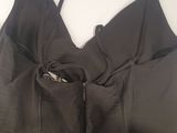 a close up of a black top with a zipper on the back