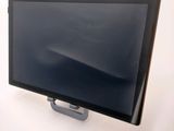 an image of a monitor on a stand on a white surface