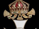 une croix surmontée d'une couronne