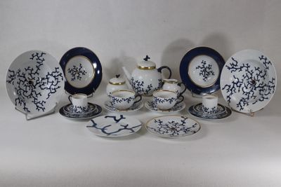 many plates and cups that are sitting on a table