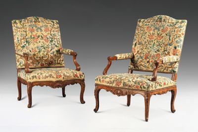 pair of louis xv style carved walnut armchairs