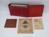 un vieux livre à la couverture rouge et quelques autres livres