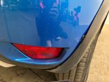 a close up of a car ' s rear end with a sticker on it