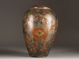 a vase that has a design on the inside of it