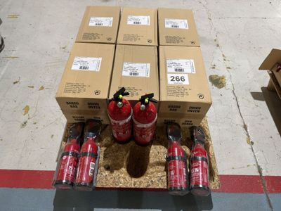 several boxes of soda are stacked on top of each other on the floor