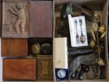 a box full of assorted items including a statue of a man and a horse