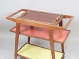 an image of a wooden serving cart with two trays on it