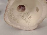 a close up of a figurine of a person with a name on it