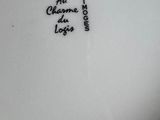 a close up of a plate with writing on it