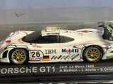 a model of a porsche gt1 race car in a display case