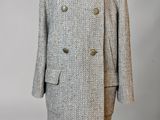 a white and black coat on a mannequin mannequin mannequin mannequin mannequin mannequin mannequin mannequin mann