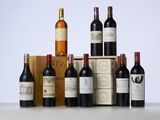 several bottles of wine sitting on top of a table next to a box