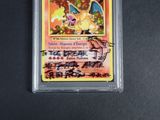 a close up of a pokemon card on a black surface