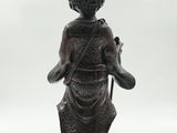 an image of a statue of a woman with a cat on her back
