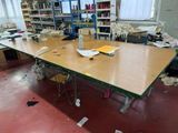 a table with a lot of papers on it in a room