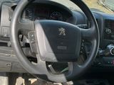 dashboard of a car with a steering wheel and dashboard controls