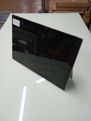 a laptop computer sitting on top of a white table