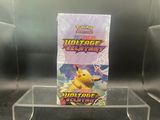 a close up of a box of pokemon trading cards on a table