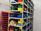 many bins and boxes on the shelves in the warehouse
