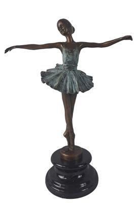 statue of a ballerina in a tutu on a pedestal