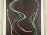 abstract painting in a wooden frame on a white wall