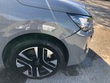 a close up of a car ' s wheel on the street