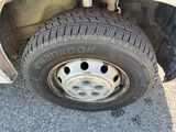 a close up of a flat tire on a truck