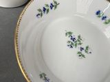 a small cup and saucer sitting on a table