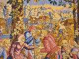 a tapestry with a picture of a man and a woman on it