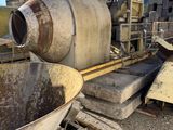a large machine that is sitting in the dirt