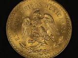 a close up of a gold coin on a black background