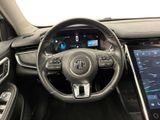 the interior of a car with a steering wheel and a touch screen