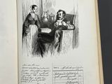 an open book with a drawing of a man and a woman sitting at a table