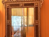 a mirror hanging on the wall in a room