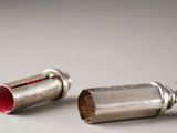 two silver objects that are on a table