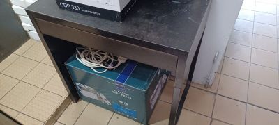 a microwave sitting on top of a table in a kitchen