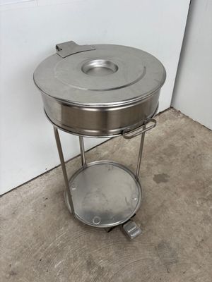 an image of a stainless steel table with a lid on it