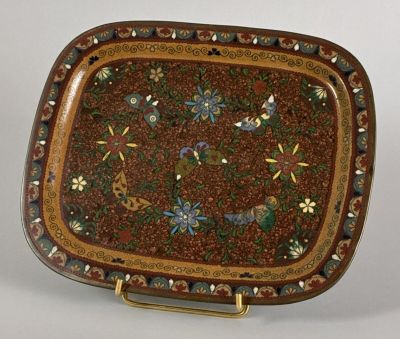 a decorative tray with flowers and birds on it