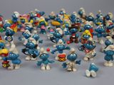 a lot of small figurines that are on a table
