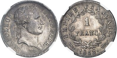 a close up of a coin on a white surface
