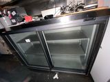 an image of a kitchen with a refrigerator and a counter