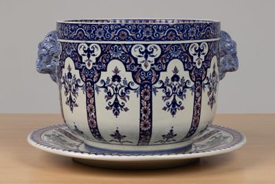 a blue and white bowl and saucer on a table