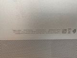 an image of a close up of the back of a silver speaker