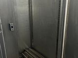 a metal elevator with a metal floor in a building