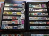 a lot of stamps on the pages of a book