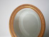 a mirror sitting on top of a marble counter