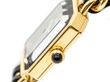 an image of a close up of a wrist watch with a chain around it