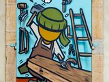 painting of a man working on a piece of wood on a wall