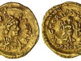 une pièce d'or portant l'image d'un homme et d'une femme