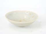 a white bowl that is sitting on a table